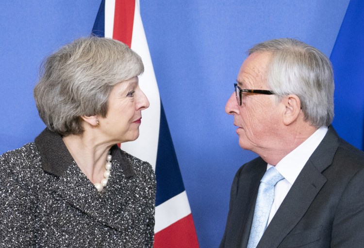 Theresa May, U.K. prime minister, with Jean-Claude Juncker, president of the European Commission, ahead of talks in Brussels on Dec. 11.