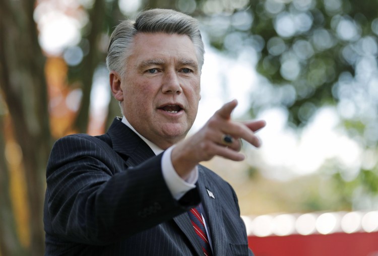 Republican candidate Mark Harris, speaking to the media Nov. 7 in Matthews, N.C., is at the center of a still-undecided U.S. House race marred with ballot fraud allegations.