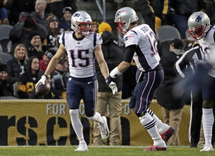 Chris Hogan, left, and Tom Brady connected for New England's only touchdown in a 17-10 loss in Pittsburgh on Sunday.