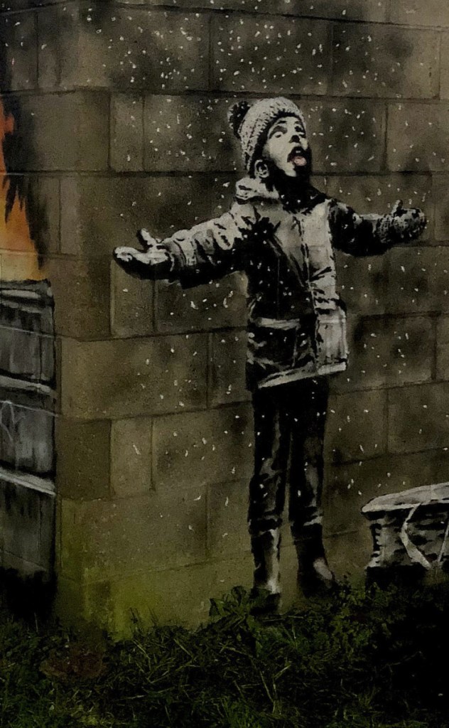 Twitter/@RHoneyJones via AP
The snowflakes depicted by Banksy on a garage in Port Talbot, Wales, are actually ashes referencing dirty air.