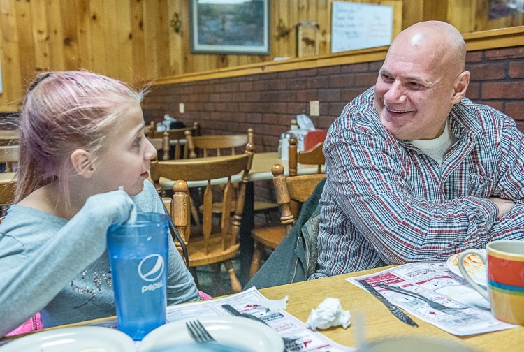 Dale Korhonen Sr. shares a laugh with his daughter, Kali, 10, when the two were having lunch at Dick's Restaurant in Mexico.