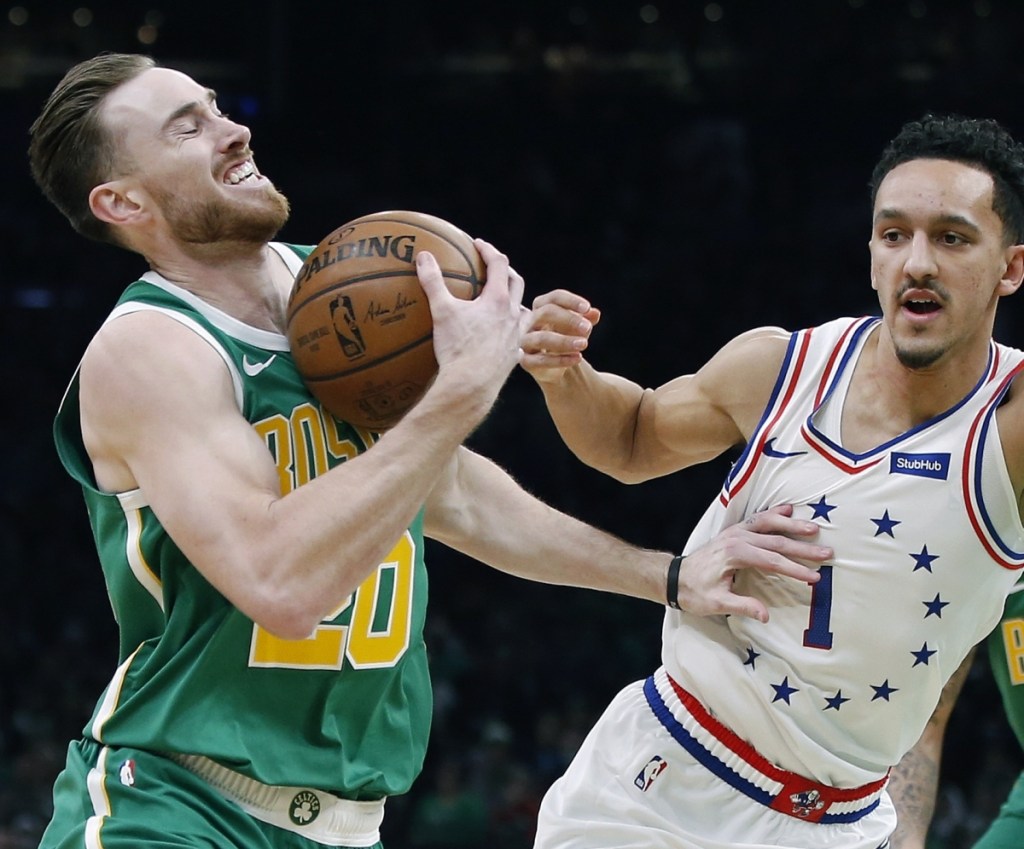 Boston Celtics' Gordon Hayward (20) is defended by Philadelphia 76ers' Landry Shamet (1) during the first half of an NBA basketball game in Boston, Tuesday, Dec. 25, 2018. (AP Photo/Michael Dwyer)