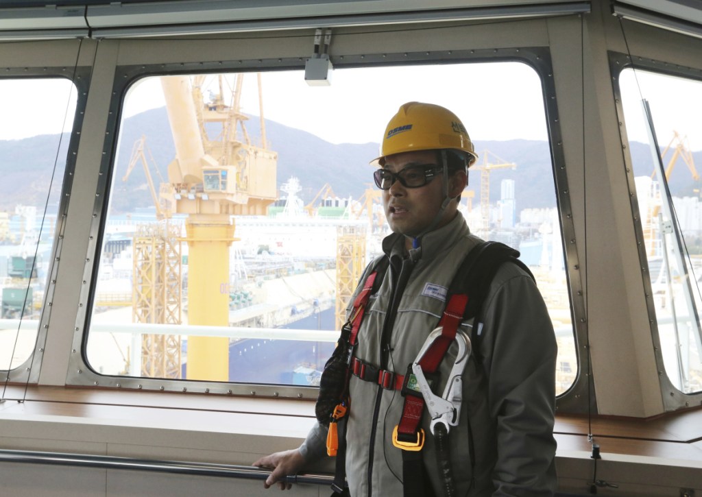 In this Friday, Dec. 7, 2018 photo, Song Ha-dong, a senior official from Daewoo Shipbuilding and Marine Engineering, speaks during an interview on the building of a large-sized liquefied natural gas (LNG) carrier at the Daewoo Shipbuilding and Marine Engineering facility in Geoje Island, South Korea. "The U.S.-led shale gas boom is getting fully under way and China, Japan and South Korea are increasing their consumption of natural gas," he said. (AP Photo/Ahn Young-joon)