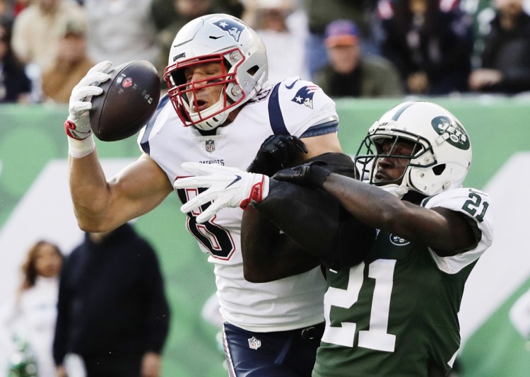 New England tight end Rob Gronkowski had three catches for 56 yards and a touchdown – and a battle or two with Jets cornerback Morris Claiborne, right – in a 27-13 New England win on Nov. 25.