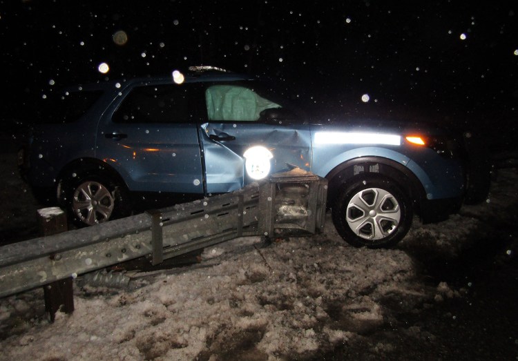 State police say Trooper Ryan Keller was parked in the breakdown lane on the Maine Turnpike in New Gloucester when a car driven by Nancy Colson, 22, of Topsham hit the rear of the cruiser, forcing it into a guardrail.