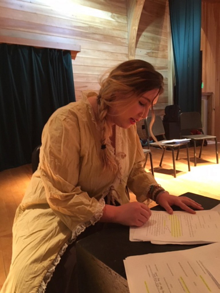 Carli Negron-Maron, who plays Mary Wollstonecraft in the play "Mary, Mary," is editing her script at Maine Arts Academy in preparation for the one-act performances.