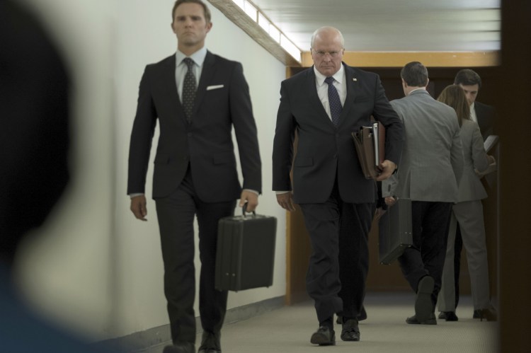 Christian Bale, center, as Dick Cheney in Adam McKay's "Vice."