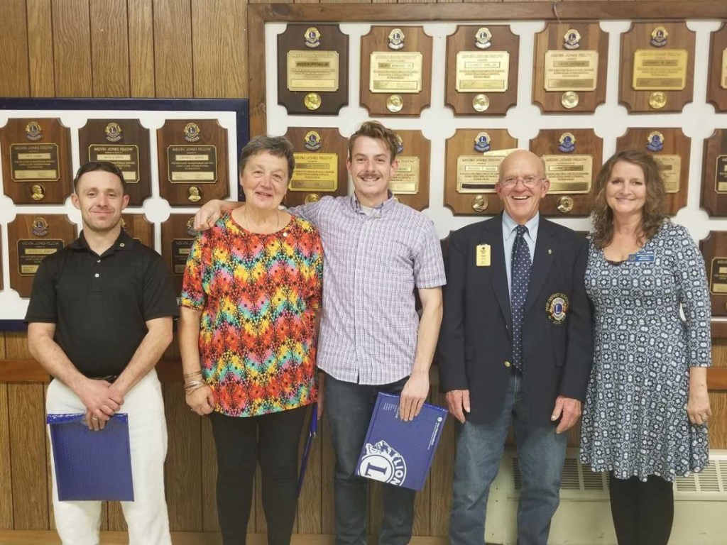 The new members of the Whitefield Lions Club from left are Justin Lyshon, Fran Randall and Ben Stratton, with Past District Governor Tim Chase, and Whitefield Lions Club President Kim Haskell.