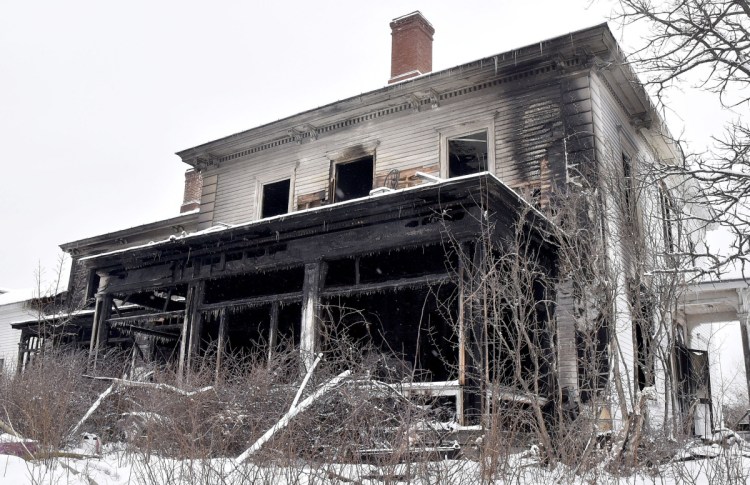 Fire damage mars the front of a large home at 46 Main St. in North Anson. The accidental blaze killed 63-year-old William Bloom on Thursday.