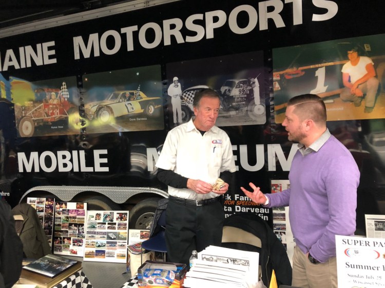 Standing next to the Maine Motorsports Mobile Museum on Saturday, Maine Vintage Race Car Association president Andy Austin, right, talks with board member Bruce Elder at the Northeast Motorsports Expo at the Augusta Civic Center.