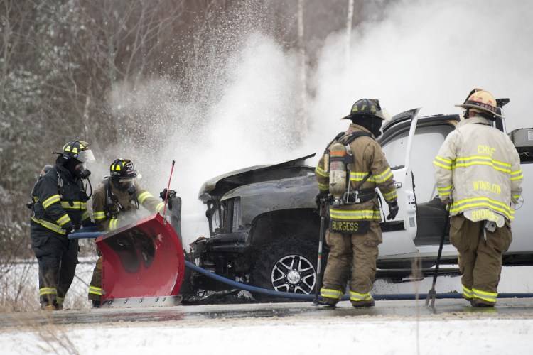 Winslow firefighters extinguish a truck fire Jan. 3 on Carter Memorial Drive in Winslow. The department finds itself short-staffed after one full-time firefighter left for another job and a second full-time firefighter will be unavailable until at least July because of an injury.
