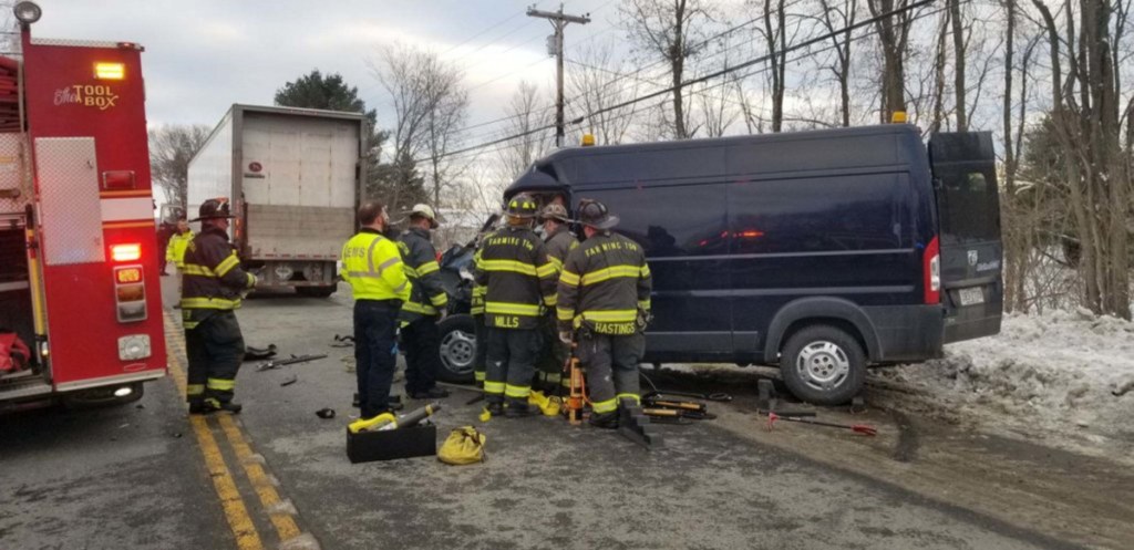 Farmington police, fire and rescue personnel assist at a rear-end collision between a state highway department van and a UPS tractor-trailer truck on Route 2 in Farmington on Tuesday afternoon. Aaron Buotte, 32, of Manchester was flown to a Lewiston hospital with serious injuries, police said.