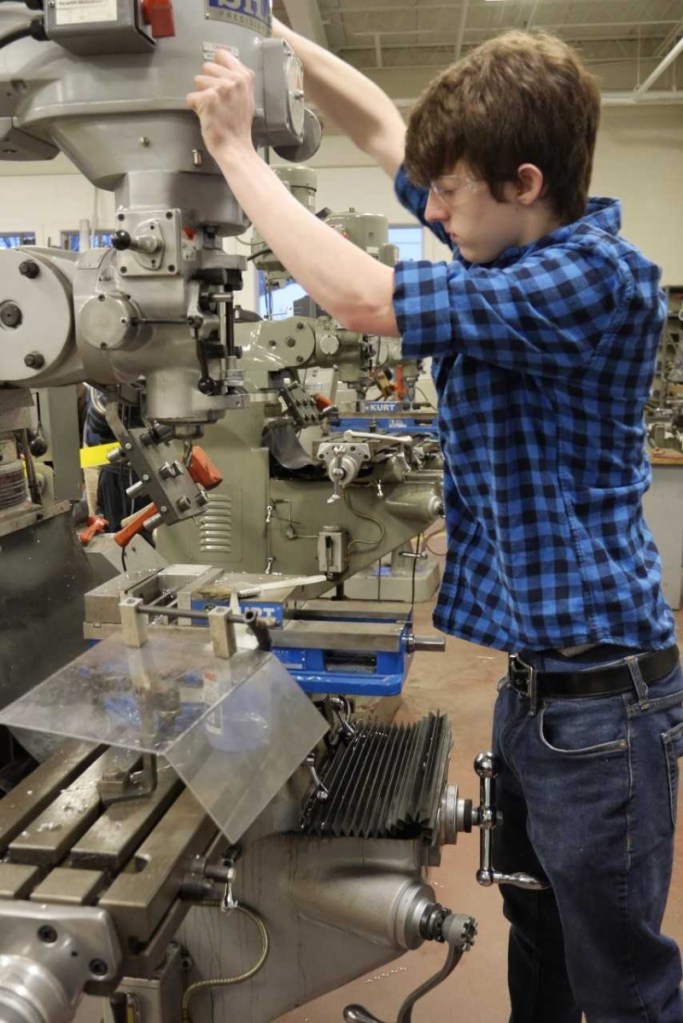 Dan Miller, a student in the precision machining program at Mid-Maine Technical Center in Waterville, and a Messalonskee High School student.