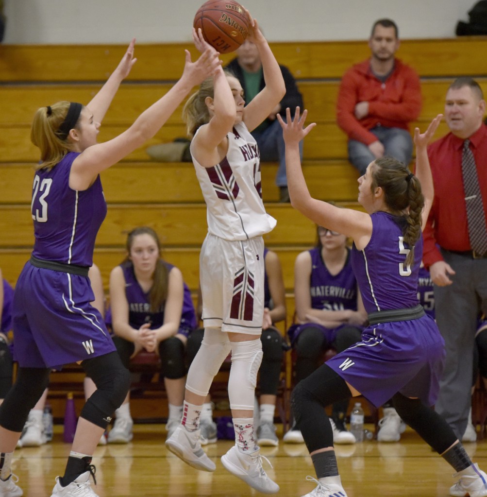 MCI's Sara Linkletter looks to make a pass as Waterville defenders Madeleine Martin, left, and Jayda Murray apply pressure during a Kennebec Valley Athletic Conference Class B game Monday afternoon in Pittsfield.