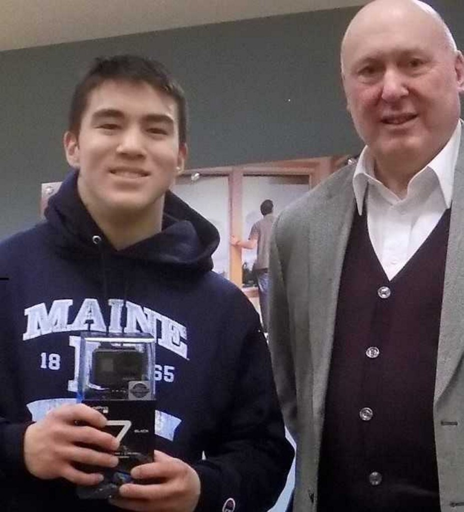 Ely Yang, left, a student at Winslow High School, and Allen Rancourt, president of Kennebec Federal Savings. Yang was selected by Kennebec Federal Savings as the winner of the preliminary round of the "Lights, Camera, Save!" video competition ssponsored by the American Bankers Association. He was presented a new GoPro camera at a ceremony Jan. 4 in Waterville.