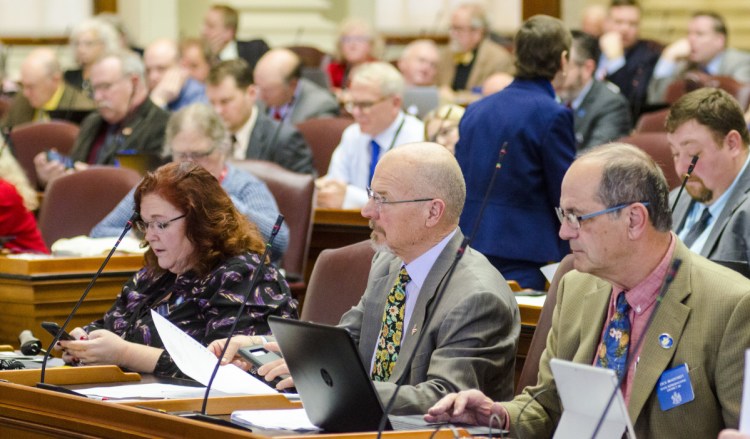 From left, Rep. Shelley Rudnicki, R-Fairfield, Rep. Larry Lockman, R-Bradley, and Rep. Dick Bradstreet, R-Vassalboro, sit in the front row of the Maine House of Representative during a session on Thursday at the State House in Augusta.