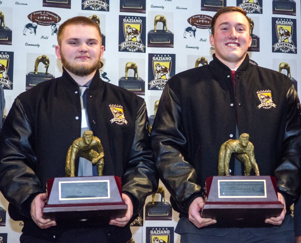 Offensive lineman Aidan McGlone, left, and defensive lineman Thomas Palmer hold trophies they won at the Frank Gaziano Award ceremony Saturday at the Augusta Civic Center.