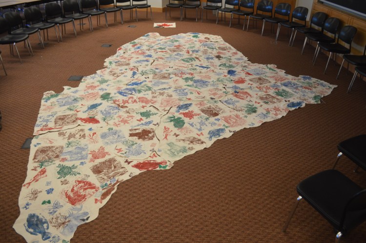 A cloth map used to represent Native American land, waterways, and plants and animals in Maine before European settlers reached North America, during a Maine-Wabanaki REACH presentation Sunday at the Unitarian Universalist Community Church of Augusta.