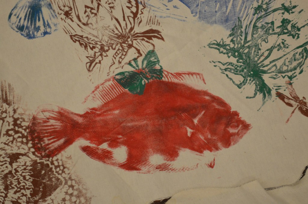 A detail shot of a fish on the cloth map used to represent Native American land, waterways, and plants and animals in Maine before European settlers reached North America, during a Maine-Wabanaki REACH presentation Sunday at the Unitarian Universalist Community Church of Augusta.