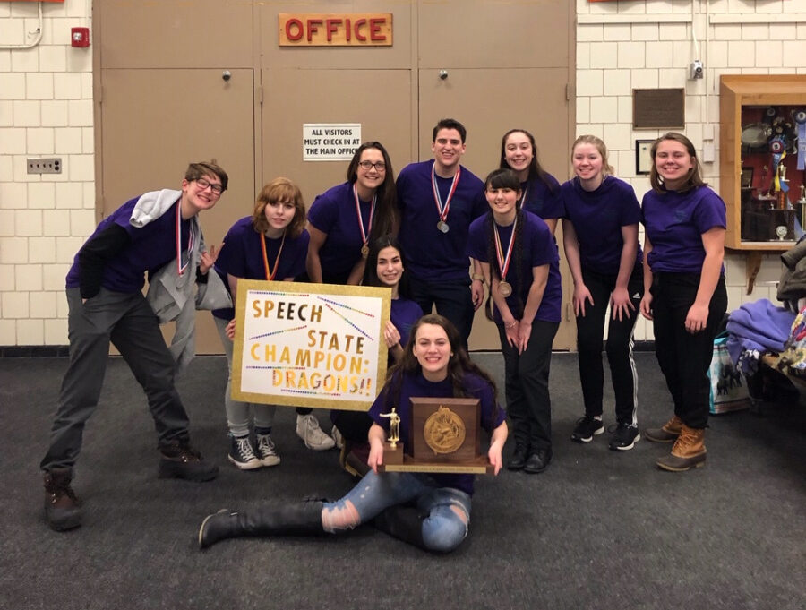 The Skowhegan Area High School speech team, pictured from left to right, are, in front, Emma York, holding their trophy; in the middle row, Sophie Wheeler, holding a sign, and Maggie Pono; and in the back, Anna Bourassa, Romy Gerstenberger, Victoria Broadley, Taylor Kruse, Lizzy Steeves, Emily Lyman and Amber Merry.