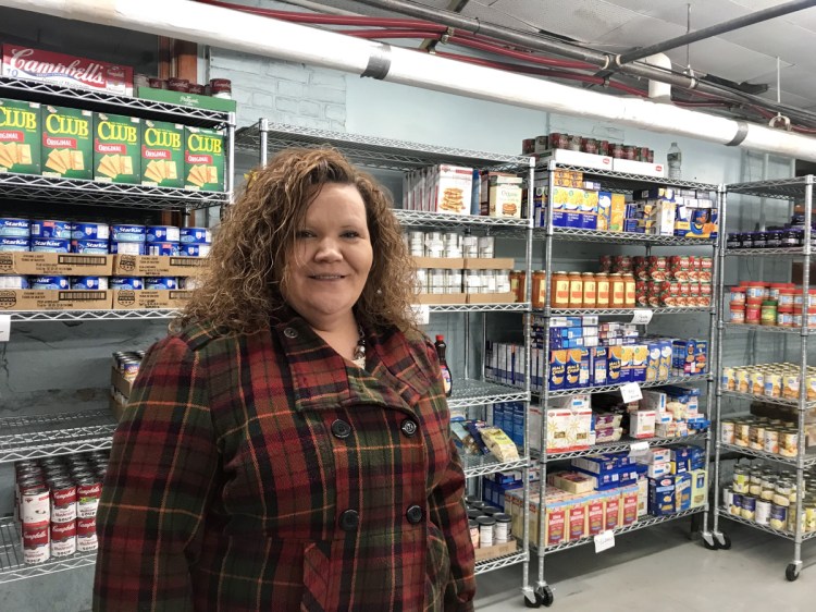 Board Chairwoman Shannon Drury, shown Tuesday evening at the People Who Care Food Cupboard in Madison, has taken criticism recently for some of the changes that have occurred in the organization.