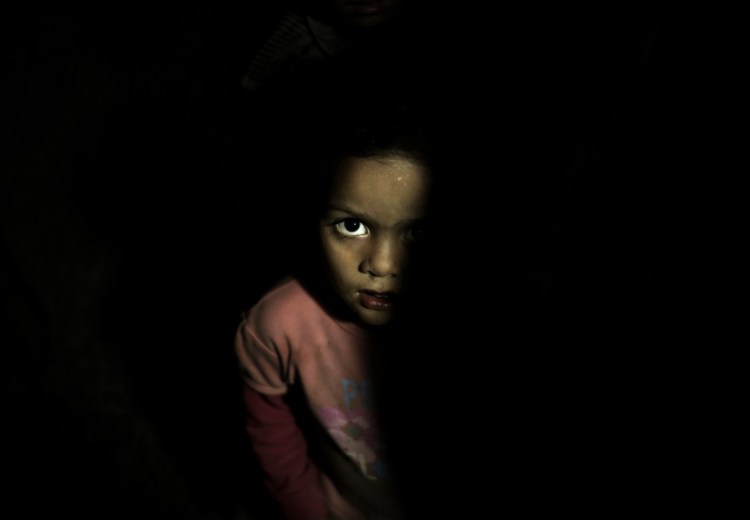 A child stands in a room at a shelter for displaced people in Ibb, Yemen, in August.