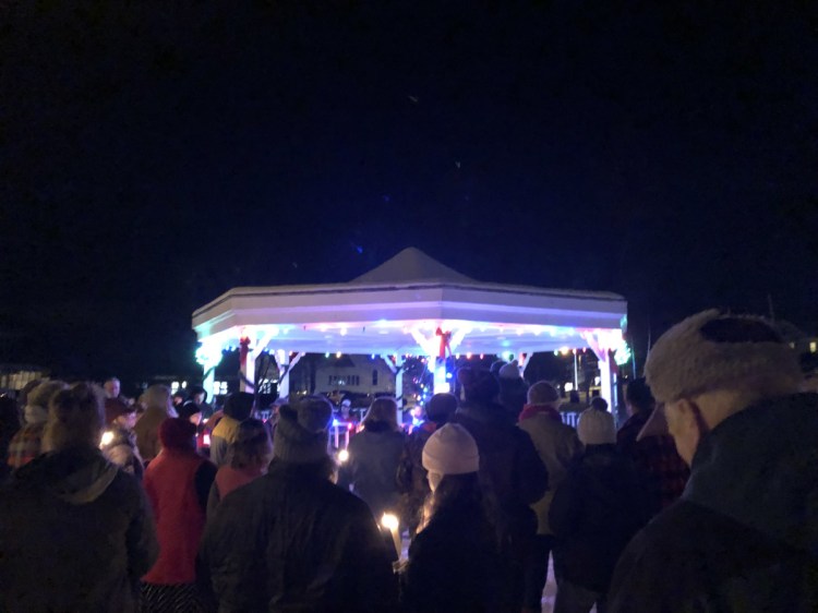 Friends, family and community members gather Saturday night in South Paris to remember Heather Bickford and Dana Hill, who were found dead in their apartment last Tuesday.