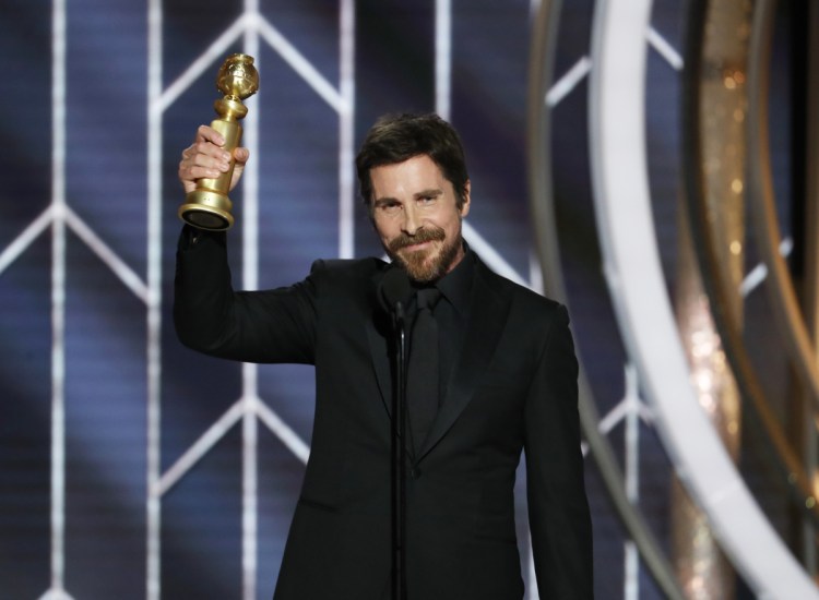 Christian Bale accepts the Golden Globe for best actor in a motion picture musical or comedy for his role in "Vice" at the Beverly Hilton Hotel on Sunday in Beverly Hills, Calif.