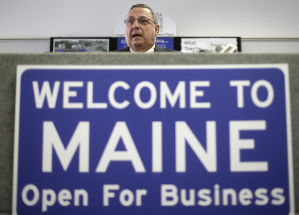 Former Gov. Paul LePage speaks at a news conference where he touted his "Open for Business" sign in Brunswick in 2014.