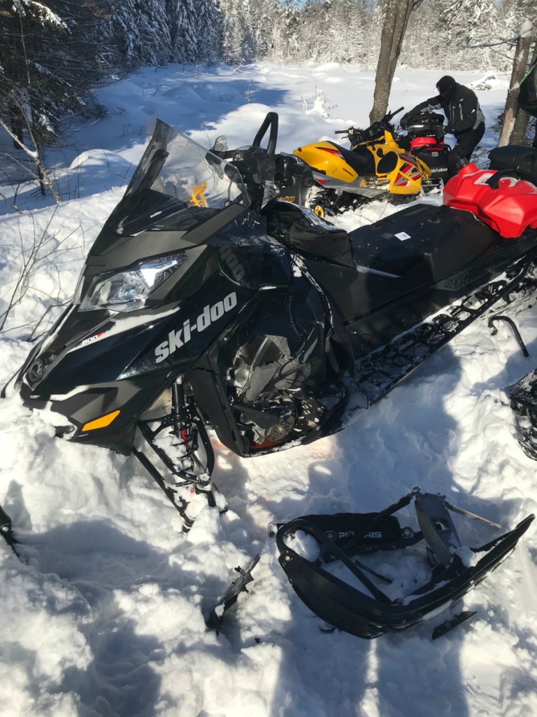 Two snowmobiles traveling in different directions collided nearly head-on Friday, injuring a 15-year-old boy and Michael Byram, 46, from Hermon.