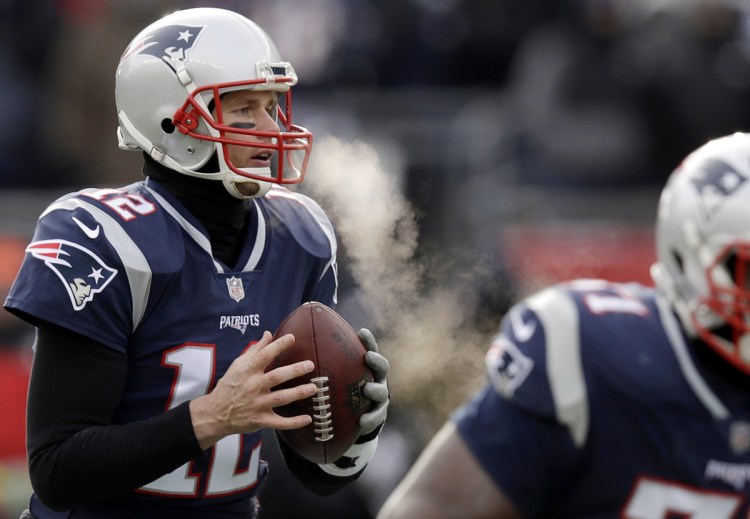 Patriots quarterback Tom Brady is no stranger to the kind of weather that let's you see your breath, as during a Dec. 31, 2017, game against the Jets in Foxborough, Mass. It should be plenty chilly at Gillette for Sunday's playoff game.