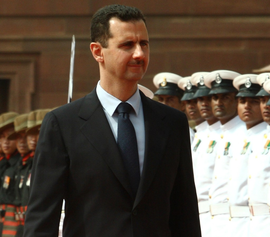 Bashar Assad, president of Syria, inspects an honor guard at a welcoming ceremony during a 2008 visit to India. Russia's intervention reversed the war.