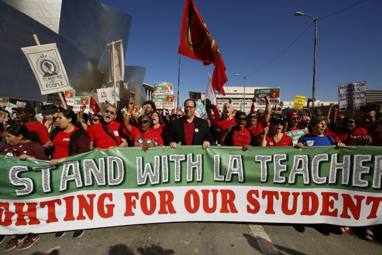 Thousands of teachers rally against the nation's second-largest school district in downtown Los Angeles. A massive teachers strike in Los Angeles is all but inevitable starting Monday, Jan. 14, 2019, after the two sides did not renew negotiations over the weekend.