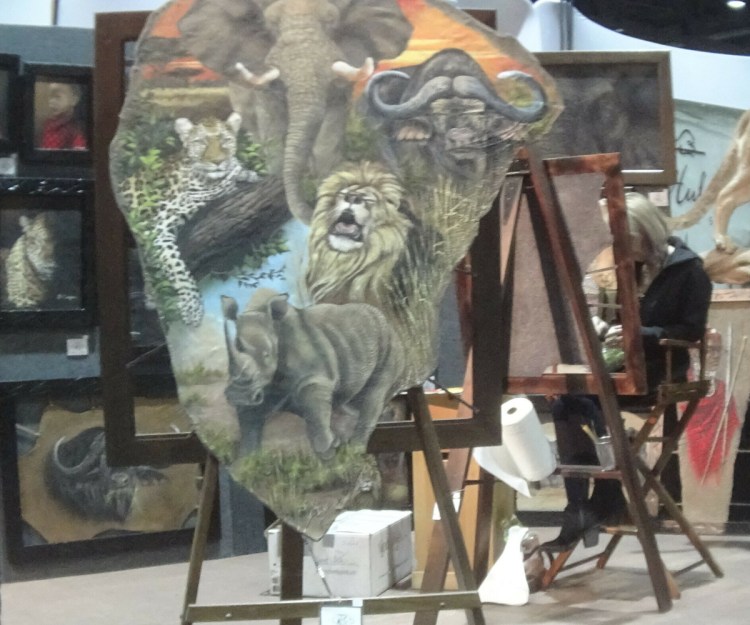 A painting on elephant hide is displayed at the Safari Club International conference in Reno, Nev., on Jan. 9. Federal and state laws restrict the sale of hides from African elephants and an investigation has been opened.