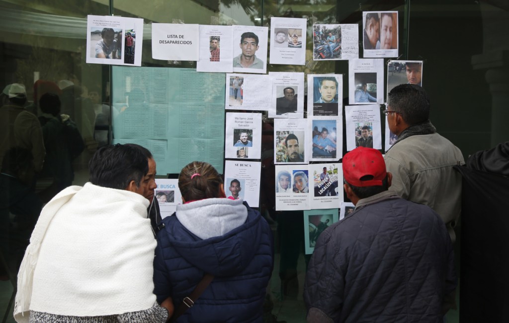 People look at photographs of people who are missing since the pipeline accident in Tlahuelilpan, Mexico, Sunday.
At least 79 people were killed in the explosion.
