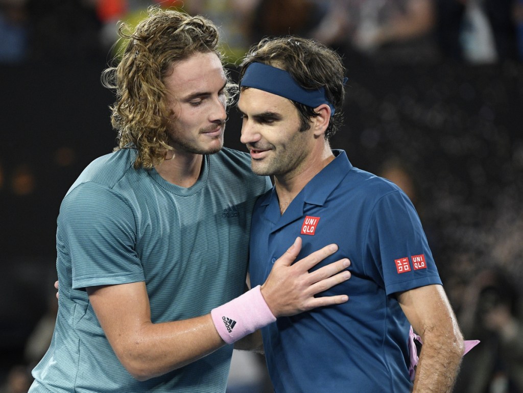 Stefanos Tsitsipas, left, reached the quarterfinals of a Grand Slam for the first time by upsetting defending champion Roger Federer at the Australian Open.