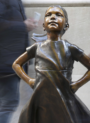 A lawsuit against "Fearless Girl" artist Kristen Visbal says she breached a contract.  Associated Press/Seth Wenig