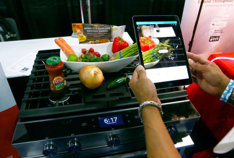 Whirlpool Corporation and Yummly team up to create smart cooking appliances through a series of over the air updates to both product software and the Whirlpool and Yummly Guided Cooking brand apps, at the CES Unveiled at CES International Sunday, Jan. 6, in Las Vegas. 