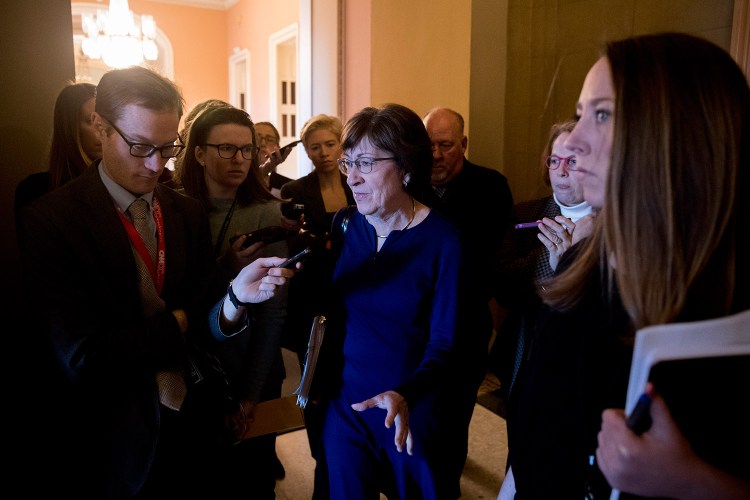Sen. Susan Collins, R-Maine, speaks to reporters as she walks into the office of Senate Majority Leader Mitch McConnell of Kentucky for a meeting with Senate Republicans on Thursday.