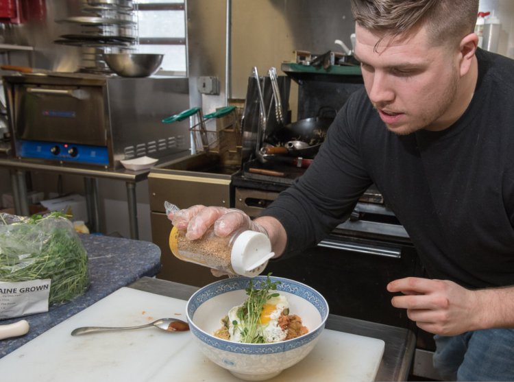 Boba chef Zach Pratt adds the finishing touches to a dish in a 2017 file photo. Pratt's one of eight people participating in the new class of Top Gun LA entrepreneurs to grow his Lewiston business.