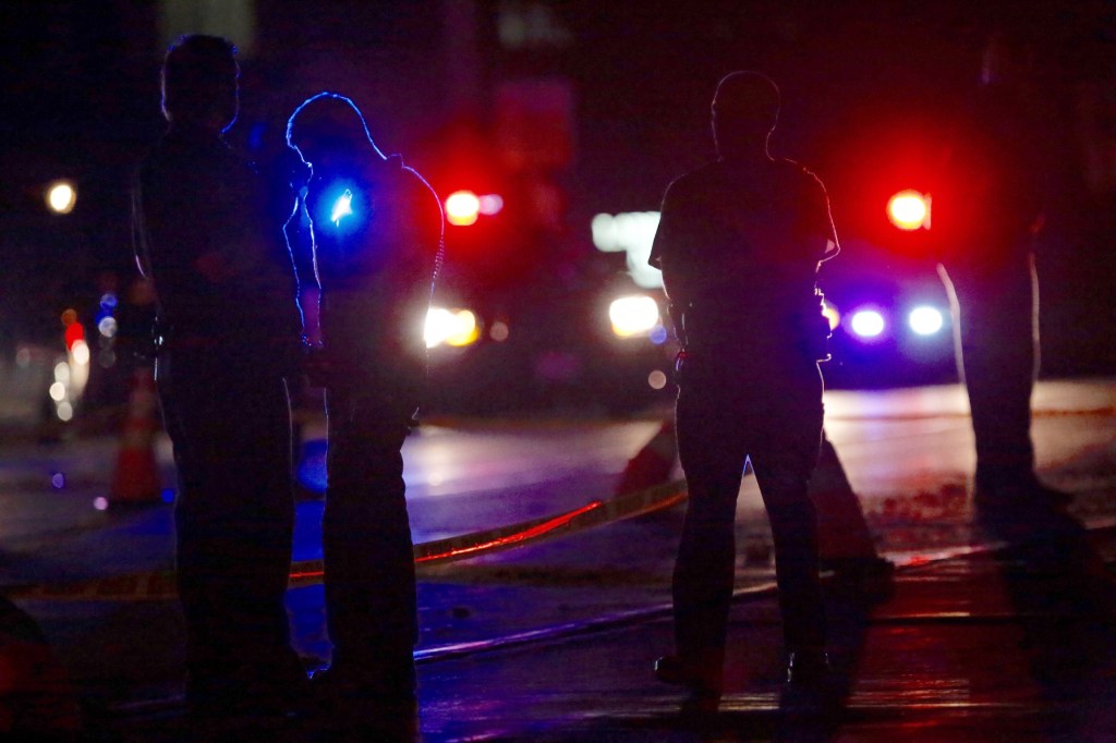 Investigators work at the scene of the shooting Wednesday night in Falcon Heights, Minn. Leila Navidi/Star Tribune via AP