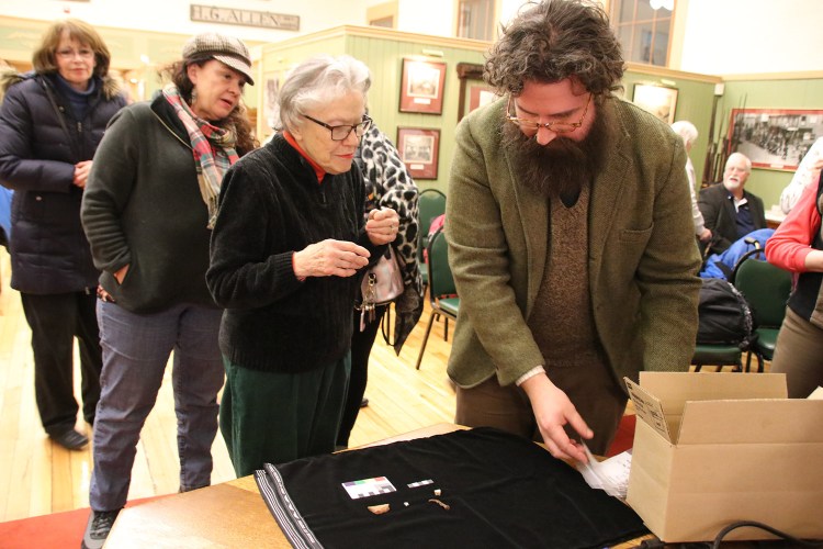 Terry Parsons chats with University of New England professor Arthur Anderson about artifacts found last summer in an archaeological dig in Sanford during a presentation Thursday at the Sanford Springvale Historical Museum. Those who conducted the dig hoped to find  evidence of the 1740s Phillipstown garrison.