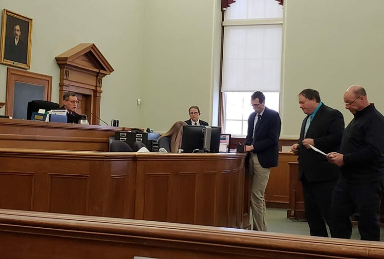 Brandon Luzzi, far right, in Knox County Superior Court on Wednesday. From left, Justice Bruce Mallonee, court security supervisor Jenn Daniels, Deputy District Attorney Jeffrey Baroody, defense attorney Michael Harman, and Luzzi. 