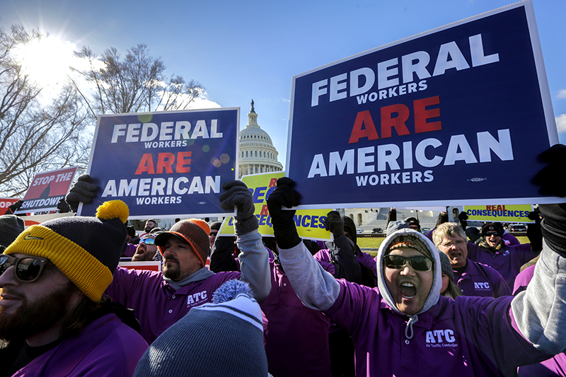 On the 20th day of a partial government shutdown, federal employees rally at the Capitol to protest the impasse between Congress and President Donald Trump.