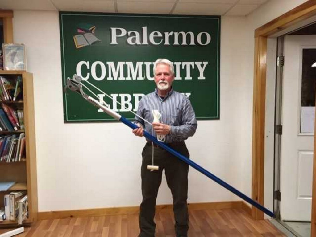 Don Salvatore with the new pole pruner that is available for patrons to borrow to prune any brown tail moth winter webs from their trees.