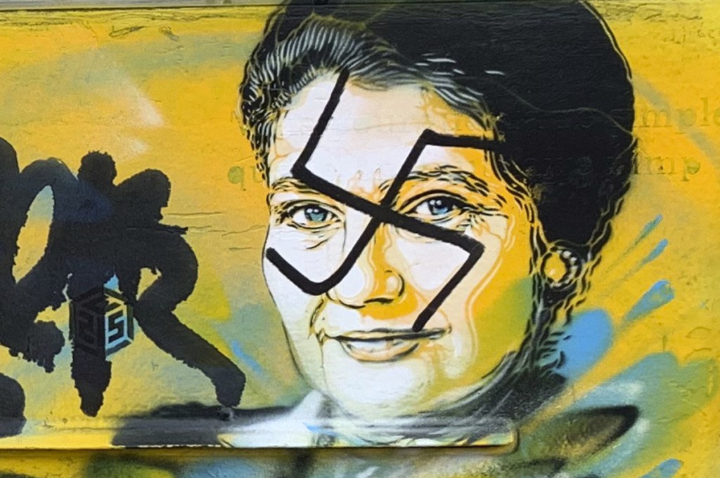 A swastika covers the face of late Holocaust survivor and French politician Simone Veil on a mailbox in Paris on Monday.
Mairie du XIIIth via AP