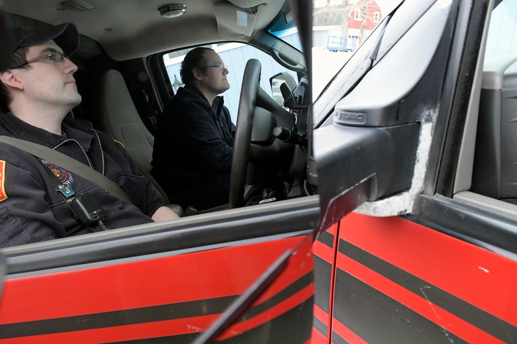 Gardiner firefighters Eric Davis, left, and Gary Hickey arrive at a call site Thursday in Farmingdale.