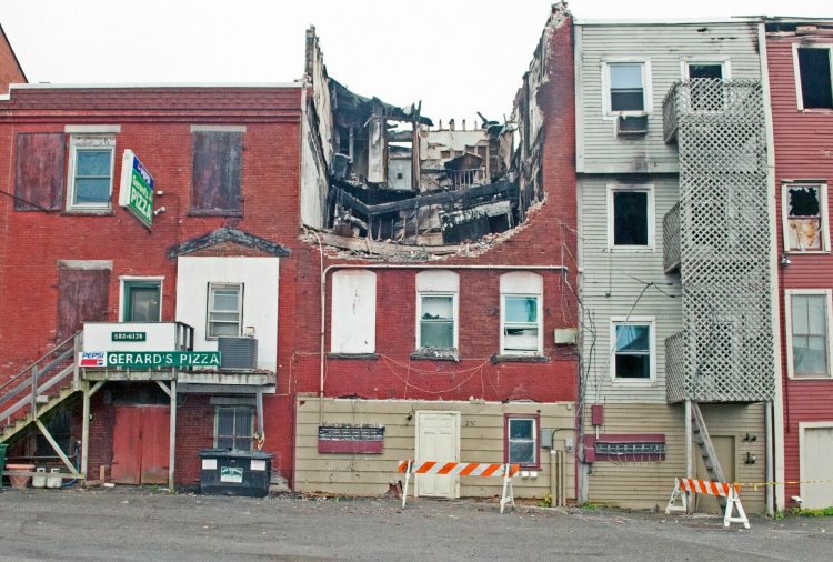 The collapsed roof of the building at 235 Water St. in Gardiner, as it looked on Oct. 22, 2015. The building was heavily damaged by a fire earlier that year.