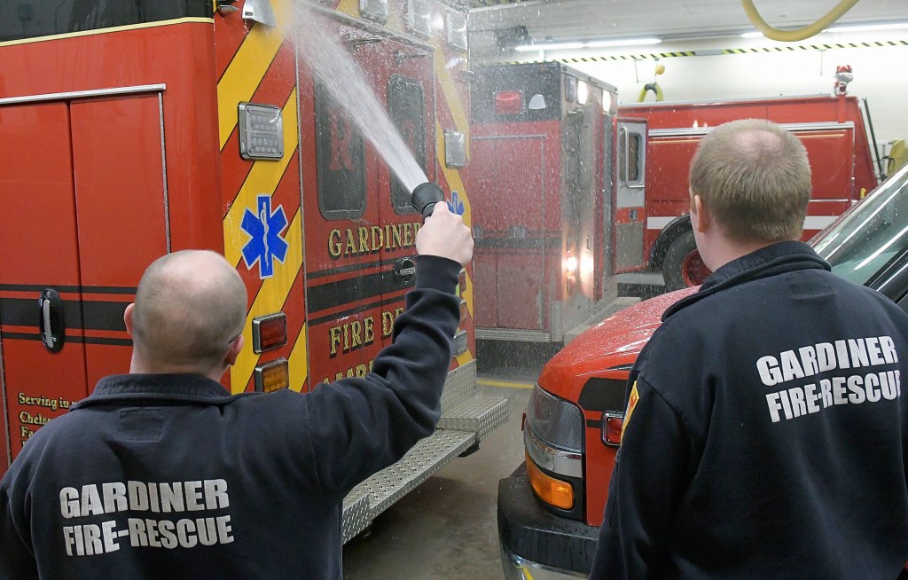 Kennebec Journal photo by Andy Molloy
Gardiner firefighter/paramedics wash a truck at the station on Monday. The Gardiner City Council will discuss staffing of the department on Wednesday.