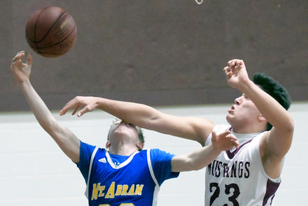 Monmouth Academy's Brock Bates denies Mt. Abram's Hunter Warren a shot during a game Thursday in Monmouth.  